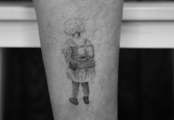 Handpoked tattoo photograph of a young girl